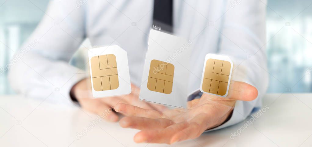 View of a Businessman holding Different size of a smartphone sim card 3d rendering