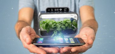 Bağlı bir dijital bitkisel bitki tutan bir Businesmann görünümünü 