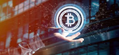 Bir teknoloji Bitcoin simgesi üzerinde bir daire 3d render tutan bir adam görünümü