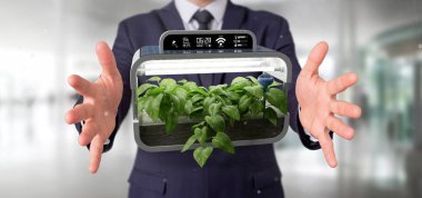 Bağlı bir dijital bitkisel bitki tutan bir Businesmann görünümünü 