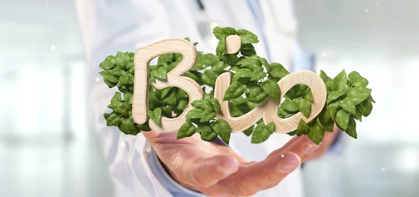 View of a Doctor holding Wooden logo bio with leaves around 3d rendering