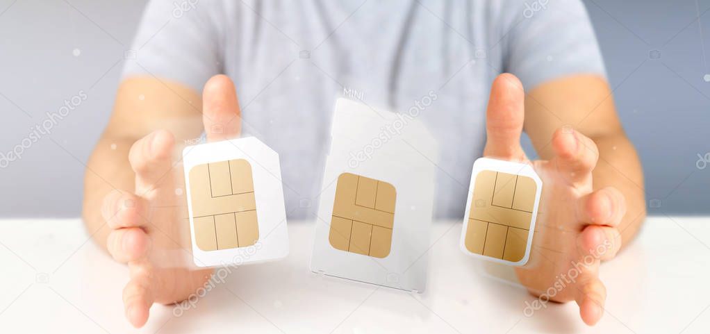 View of a Businessman holding Different size of a smartphone sim card 3d rendering