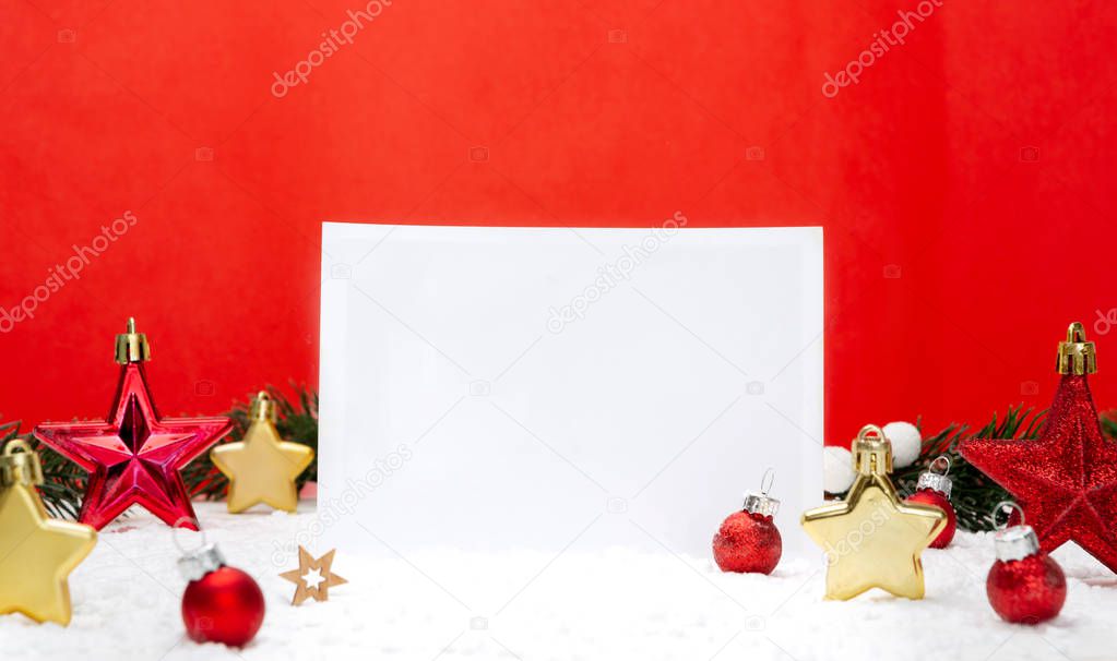 View of a Blank christmas holidays greeting card on a red background