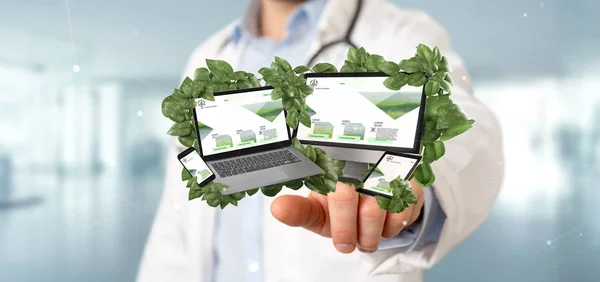 View of a Doctor holding a Connected devices surrounding by leaves 3d rendering