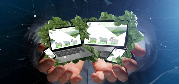 Businessman holding a Connected devices surrounding by leaves 3d