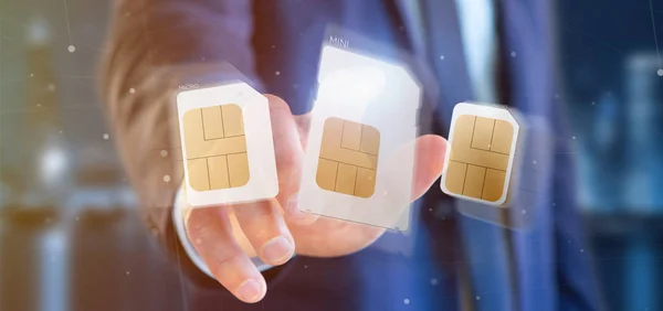 Businessman holding Different size of a smartphone sim card 3d r — Stock Photo, Image