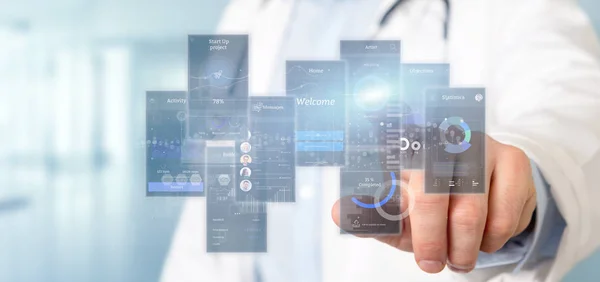 Doctor holding User interface screens with icon, stats and data — Stock Photo, Image