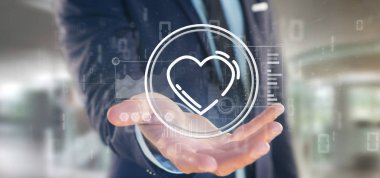 Veri ile çevrili bir kalp simgesi tutan işadamı