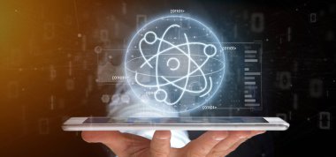 Veri ile çevrili bir atom simgesi tutan işadamı