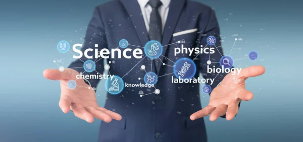 Affärs man innehar Science ikoner och titel — Stockfoto