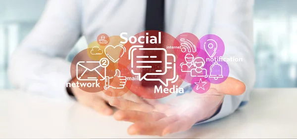 Üzletember kezében egy felhő a szociális média hálózat ikon — Stock Fotó