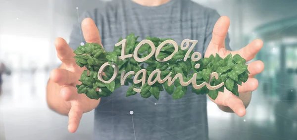 Zakenman die een houten logo 100% organische met verlaat arou — Stockfoto