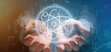 Veri ile çevrili bir atom simgesi tutan işadamı
