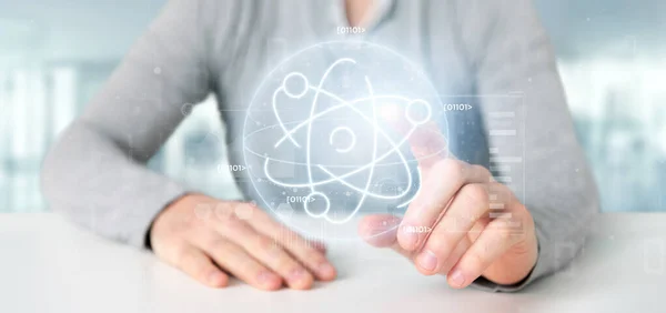 Businessman holding an atom icon surrounded by data — Stock Photo, Image