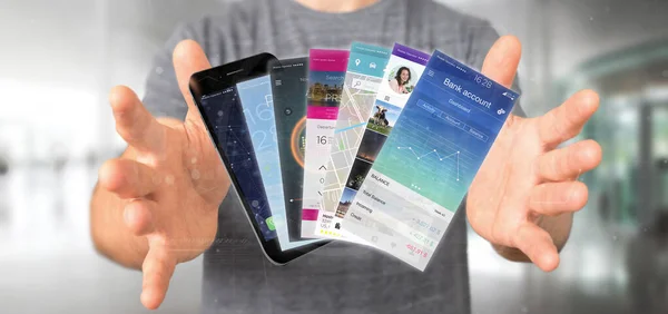 スマート フォンでモバイル アプリケーション テンプレートを保持している実業家 — ストック写真