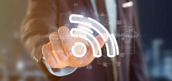 Geschäftsmann hält ein Wifi-Symbol mit Daten rundherum — Stockfoto