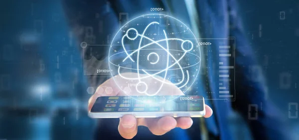 Businessman holding an atom icon surrounded by data — Stock Photo, Image