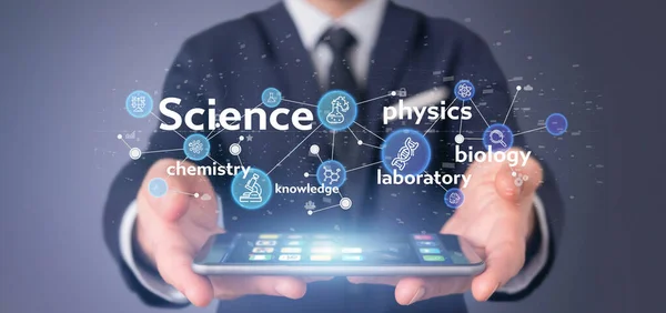 Businessman holding Science icons and title — Stock Photo, Image