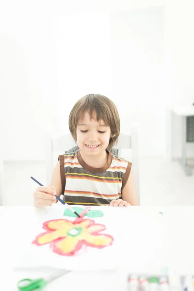 Little boy at home drawing and playing — Stock Photo, Image