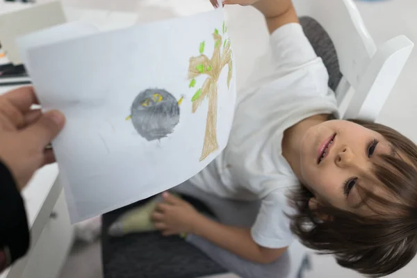 Little boy at home drawing and playing — Stock Photo, Image