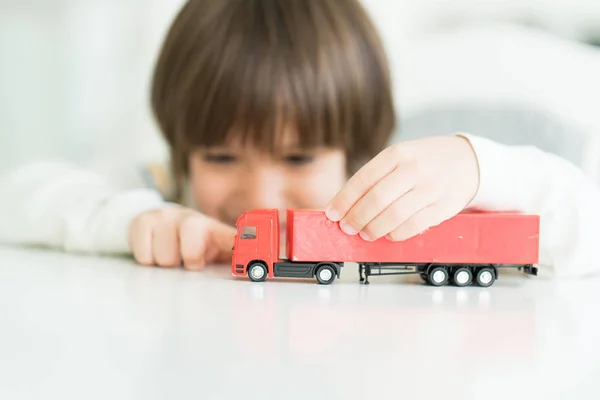 Boy playing with no name truck toy — Stock Photo, Image