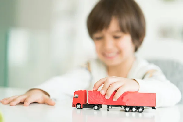 Boy playing with no name truck toy — Stock Photo, Image