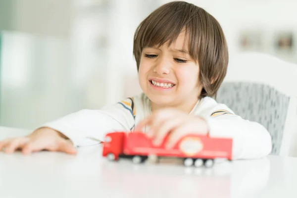 Boy playing with no name truck toy — Stock Photo, Image