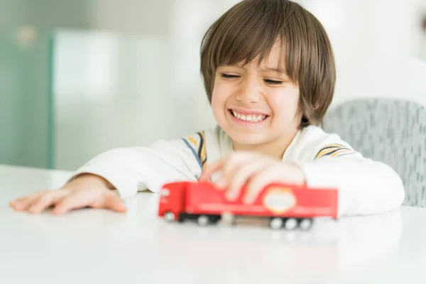 Boy playing with no name truck toy — Stock Photo, Image