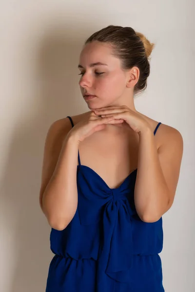 Pretty petite brunette in a blue romper dress