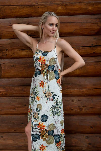 Blonde in a print dress — Stock Photo, Image