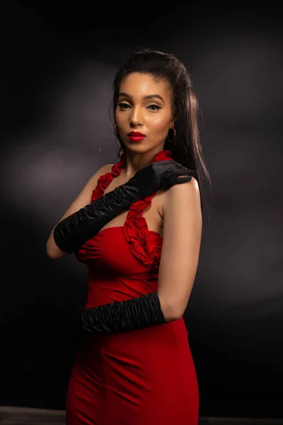 Tall brunette in red — Stock Photo © disorderly #298326316