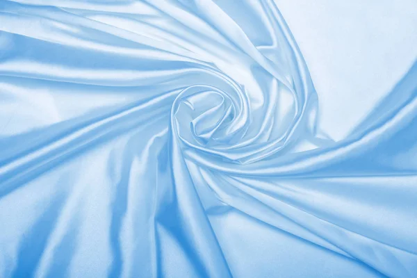 Fondo abstracto de tela de seda azul — Foto de Stock