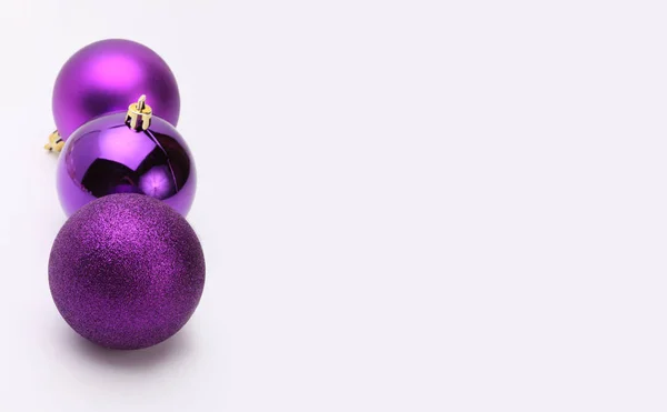 Violet Christmas balls on gray  background. — Stock Photo, Image