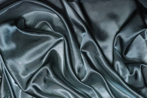 Soyut siyah mavi ipek kumaş arkaplanı — Stok fotoğraf
