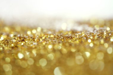 Altın (bronz) parlak noktalar konfeti. Soyut ışık yanıp sönüyor, ışıldıyor..