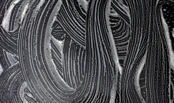 Pürüzsüz Siyah Bir Yüzeyde Köpüklü Dalga Lekeleri Soyut Doku Arkaplanı — Stok fotoğraf