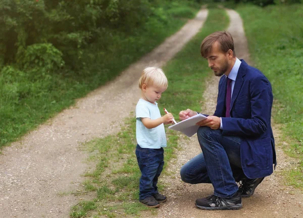 Father Gives Documents His Son Baby Writes Something Papers Business — Stock Photo, Image