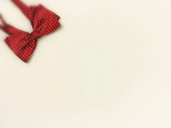 Red Bow Tie Light Cardboard Background Congratulatory Texts Blurred Top — Stock Photo, Image