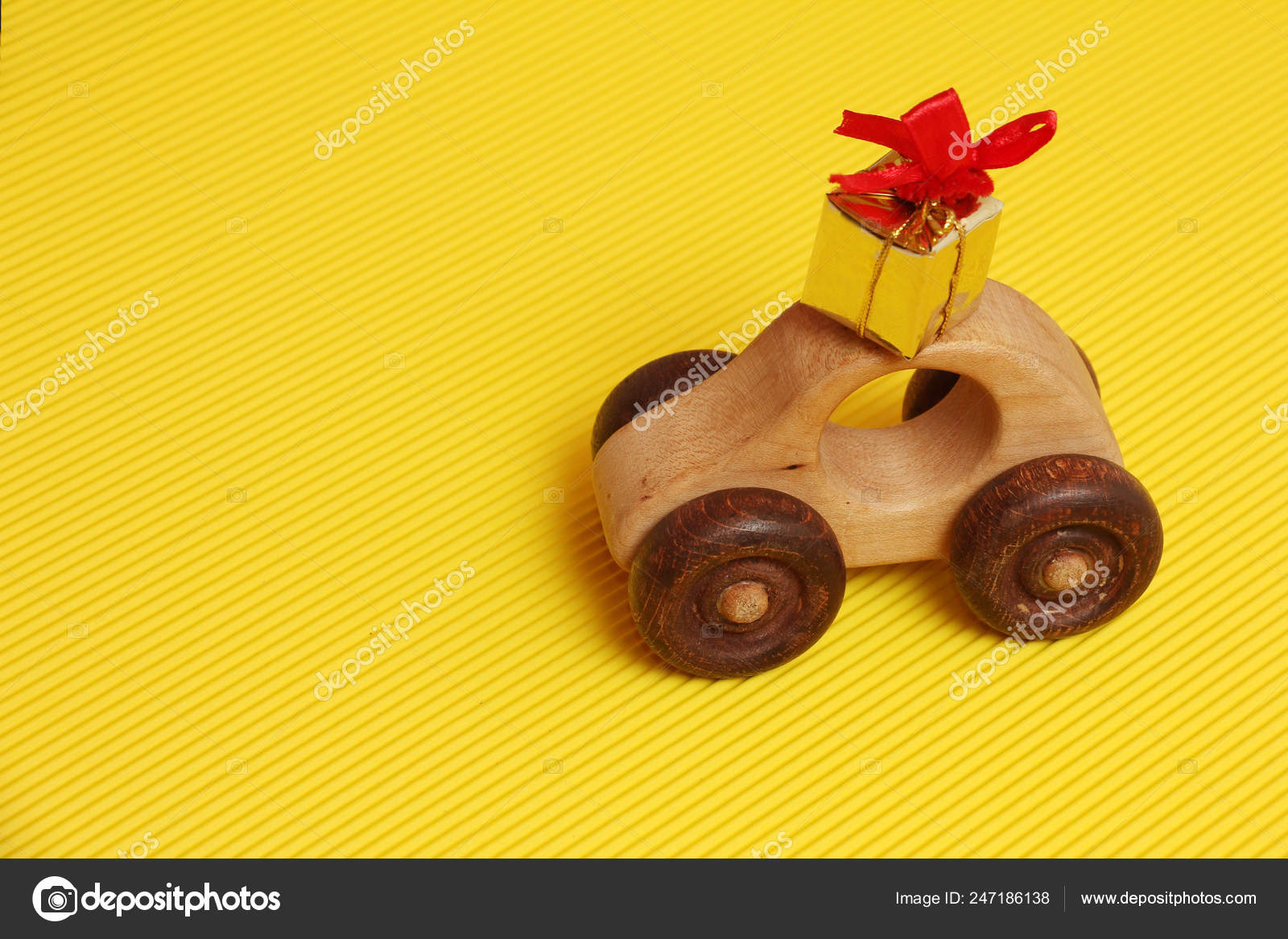 red toy car with yellow roof