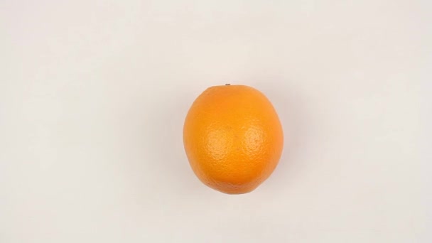 Male Hand Puts Ripe Orange White Table Spin Fruit Closeup — Stock Video