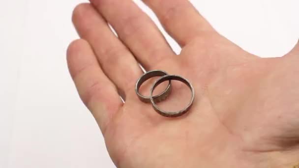 Man Demonstrates Two Silver Wedding Rings His Palm Squeezes Hand — Stock Video