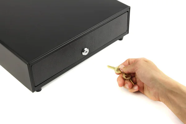 Закритий чорний грошовий ящик і рука з ключем, білий фон, c — стокове фото