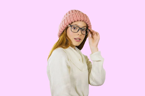 Attractive young red-haired girl with glasses looking at the camera on an isolated background — Stock Photo, Image