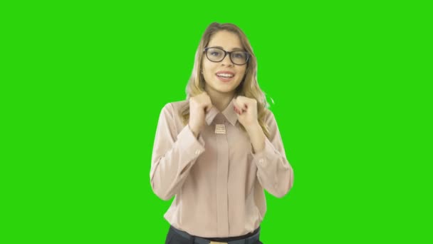 Satisfied young beautiful woman holds hands near face smiles in surprise at isolated background — Stock Video