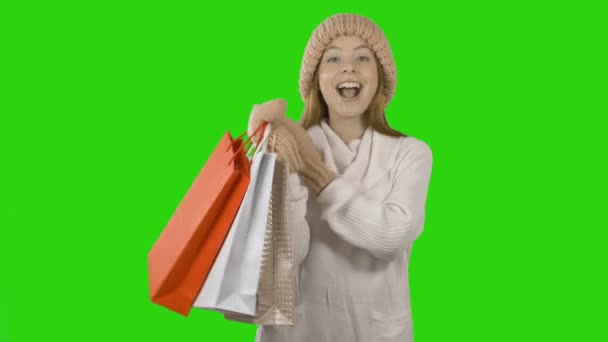 Portrait of a happy girl with paper bags after shopping — Stock Video