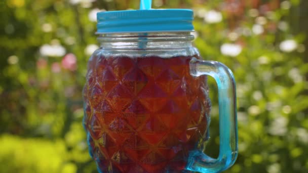 Glass mug with cold fruit drink — Stock Video