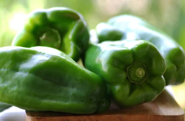 Closeup of green bell peppers on table — Stock Photo, Image