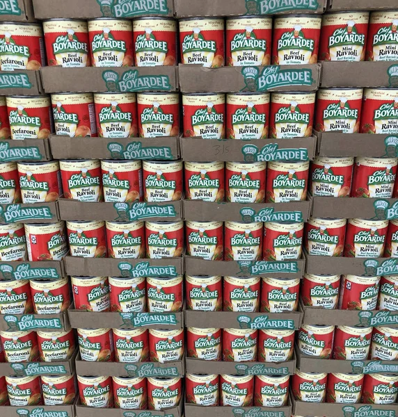 Several Canned goods on a modern Grocery store shelf — Stock Photo, Image