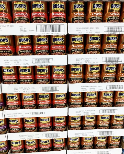 Several cans of beans on a store shelf — Stock Photo, Image