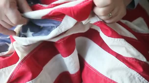 Senior Man Examines Details Vintage Fabric Flag — Stock Video